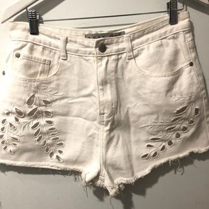 White shorts w/ peekaboo cut-outs